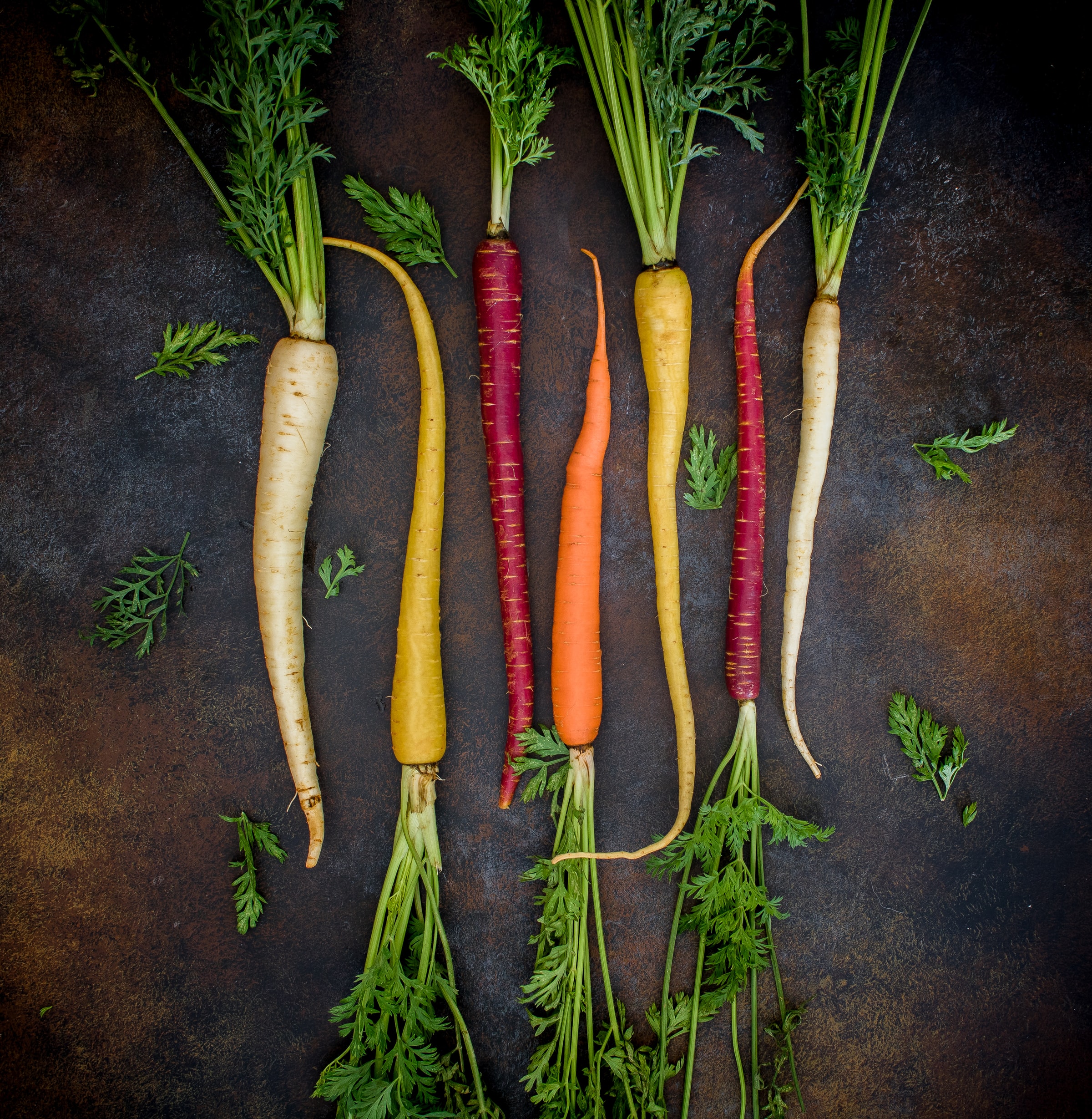 Seasonal root vegetables laid out for a Hermes Group table